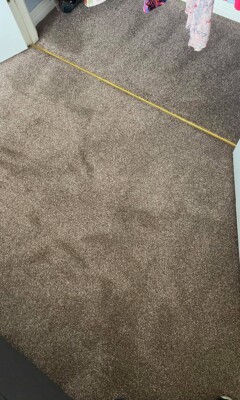 Brown carpet flooring in a bedroom
